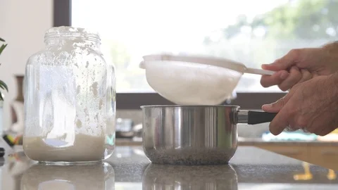 A man prepares milk kefir in the kitchen #1 Stock Footage 111417599
