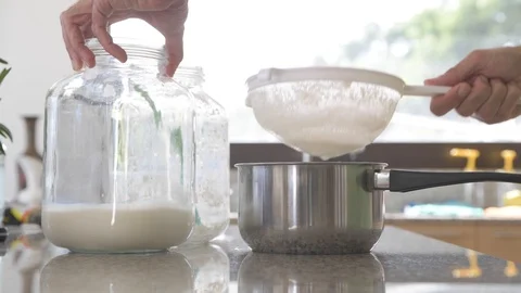 A man prepares milk kefir in the kitchen #3 Stock Footage 111419489