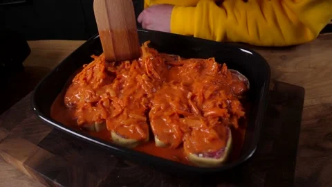 A man prepares a roll of dough stuffed with meat, onions and spices Stock Footage 136830579