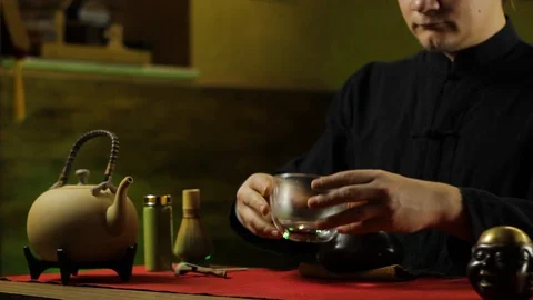 A man prepares tea according to a traditional recipe Stock Footage 103801715