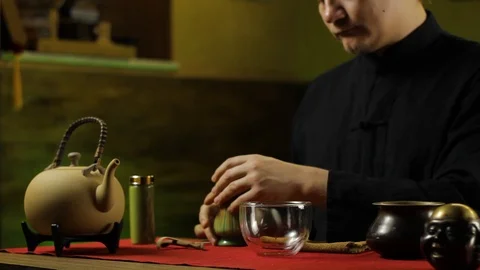 A man prepares tea according to a traditional recipe Stock Footage 103801722