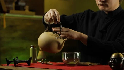 A man prepares tea according to a traditional recipe Stock Footage 103801778