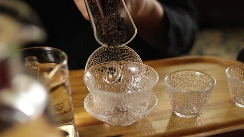 A man prepares tea according to a traditional recipe Stock Footage 104297579