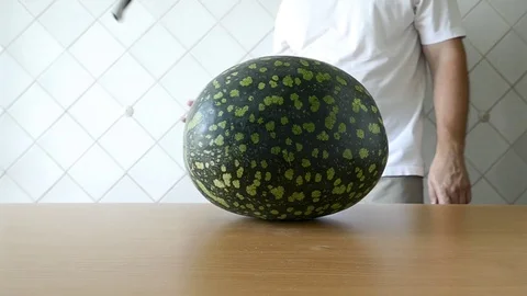 The man prepares watermelon. All clip. Stock Footage