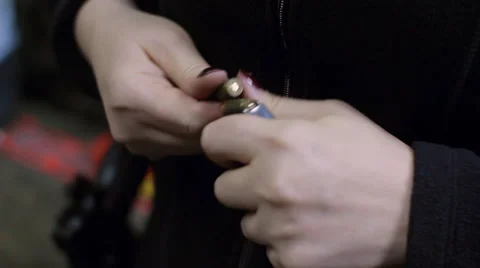 Man preparing ammunition for the pistol Stock Footage 34697001