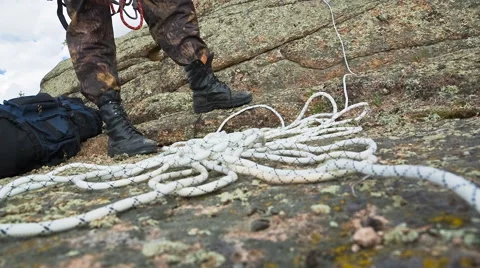 Man preparing for the ascent to the rock Stock Footage 40617707