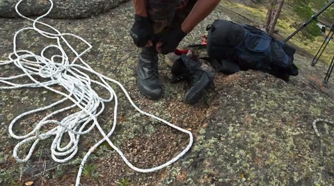 Man preparing for the ascent to the rock Stock Footage 40617753