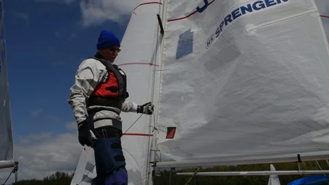 Man preparing boat to start for regatta Stock Footage 81049564