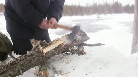 A man preparing a bonfire in the winter Stock Footage 11333153