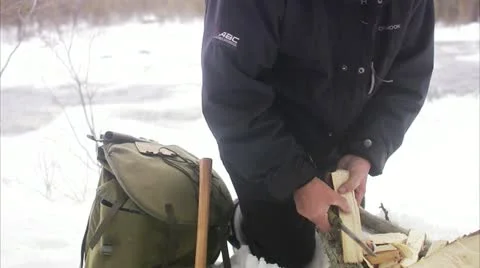 A man preparing a bonfire in the winter Stock Footage 11333156