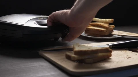 Man preparing bread toasts in grill Stock Footage 104100687