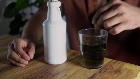 Man preparing chlorophyll detox drink Stock Footage 313500480