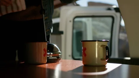 Man preparing coffee in campervan Stock Footage 107022836