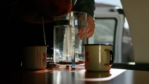 Man preparing coffee in campervan Stock Footage 107022986