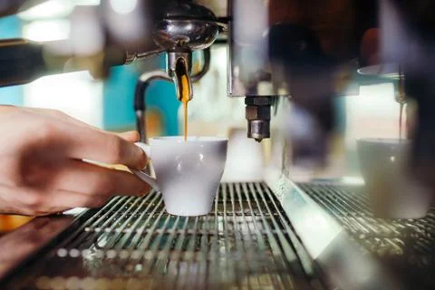 Man Preparing Coffee at Coffee Machine Stock Photos
