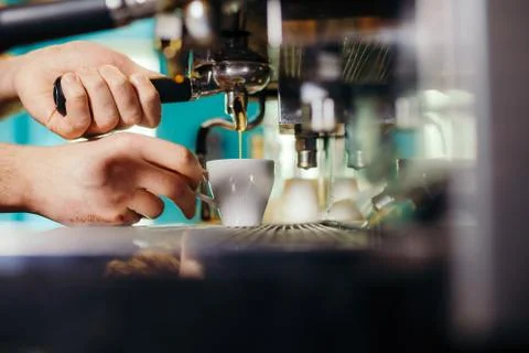 Man Preparing Coffee at Coffee Machine Stock Photos