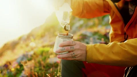 Man preparing coffee on the mountain Stock Footage 292827044
