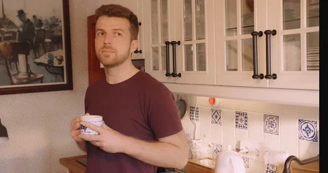 Man preparing Coffee Tea Kitchen Relaxed Perfect Morning at Home Vídeo Stock 195288514
