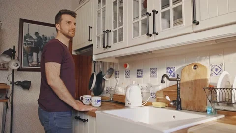 Man preparing Coffee Tea Kitchen Relaxed Perfect Morning at Home Stock-Footage 195289071