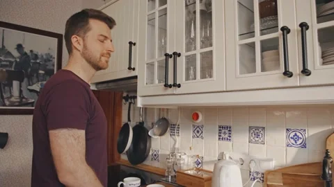 Man preparing Coffee Tea Kitchen Relaxed Perfect Morning at Home Video stock 195289086