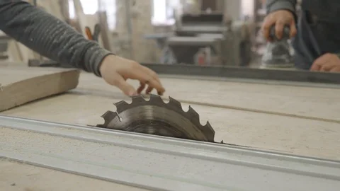 Man Preparing to Cut Wood Block in Wood Workshop in Slow Motion Stock Footage 107776694