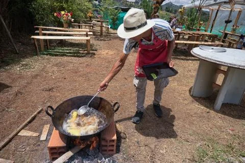 Man is preparing deep fried empanadas in Colombia Stock Photos