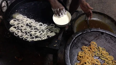 A man preparing delicious snacks popularly known as Jilaibi in India Stock Footage 100821852