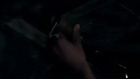 The man is preparing to detonate a hand grenade beneath the wooden plank Stock Footage 276518454