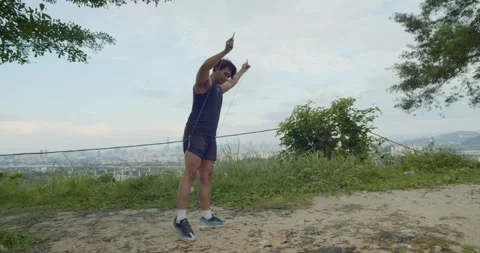 A man preparing doing Freestyle rope skipping - back side angle view Video stock 146094632