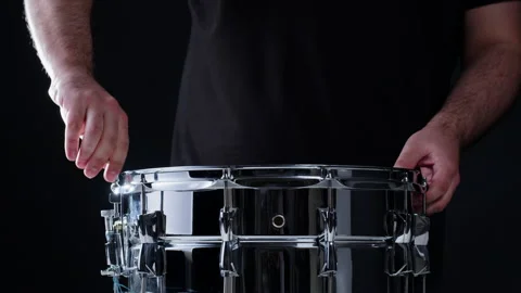 Man preparing drums close-up. Drummer playing musical instrument, professional Stock Footage 194515237