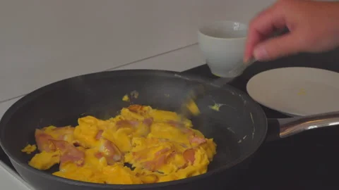 Man preparing eggs in kitchen Stock Footage 144956642