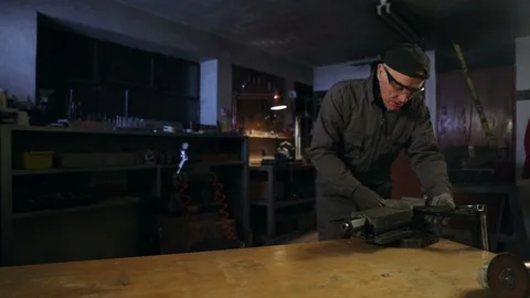 Man preparing equipment in his workshop. High definition video. Stockbeeldmateriaal 88355988
