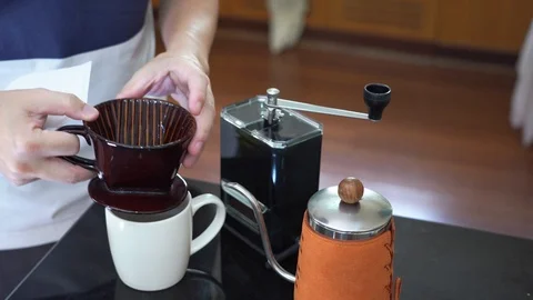 Man preparing filter paper to drip coffee at home Stock-Footage 116810037