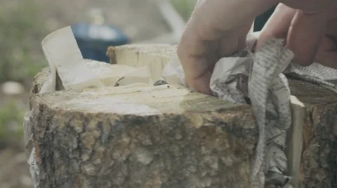 Man preparing firewood for bonfire Stock Footage 68493725