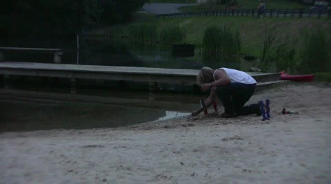 Man preparing fireworks on a beach Video stock 474681