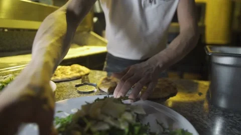 A man preparing food in a kitchen Stock Footage 155465494