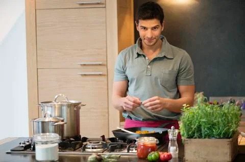 Man preparing food in the kitchen Stock Photos