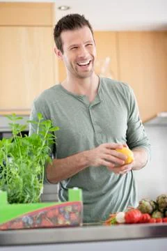 Man preparing food in the kitchen Stock Photos