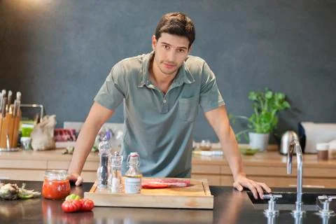 Man preparing food in the kitchen Stock Photos