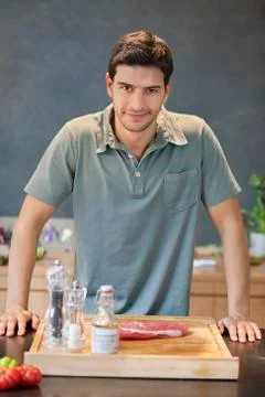 Man preparing food in the kitchen Stock Photos