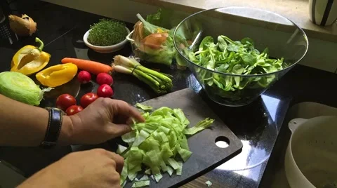 Man preparing a fresh salad  - time lapse movie Stock Footage 51655905