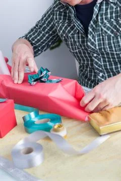 Man preparing gift Stock Photos