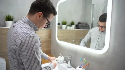 Man preparing, going to clean teeth, brushing his teeth. Tool for oral care Stock Footage 131465751