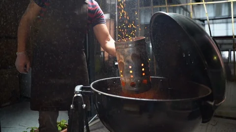 Man preparing hot coal for brazier grill. Excellent skills in preparing carbon Stock-Footage 109399506