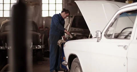 Man preparing to install cylinder head cover Stock Footage 221106996