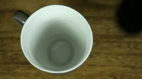 Man preparing instant coffee with milk and brown sugar Stock Footage 22323112
