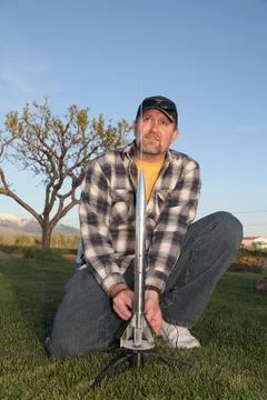 Man preparing to launch model rocket Stock Photos