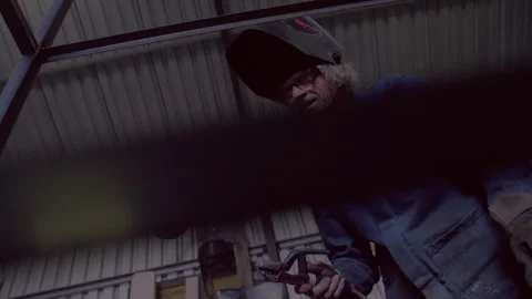 Man preparing to make a weld Stock Footage 279776164