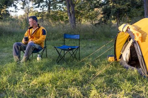 Man preparing mate in outdoor setting Stock Photos