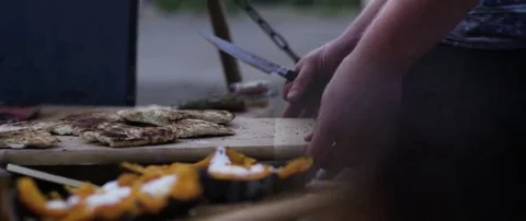 Man preparing a meal at campsite Stock Footage 69201099
